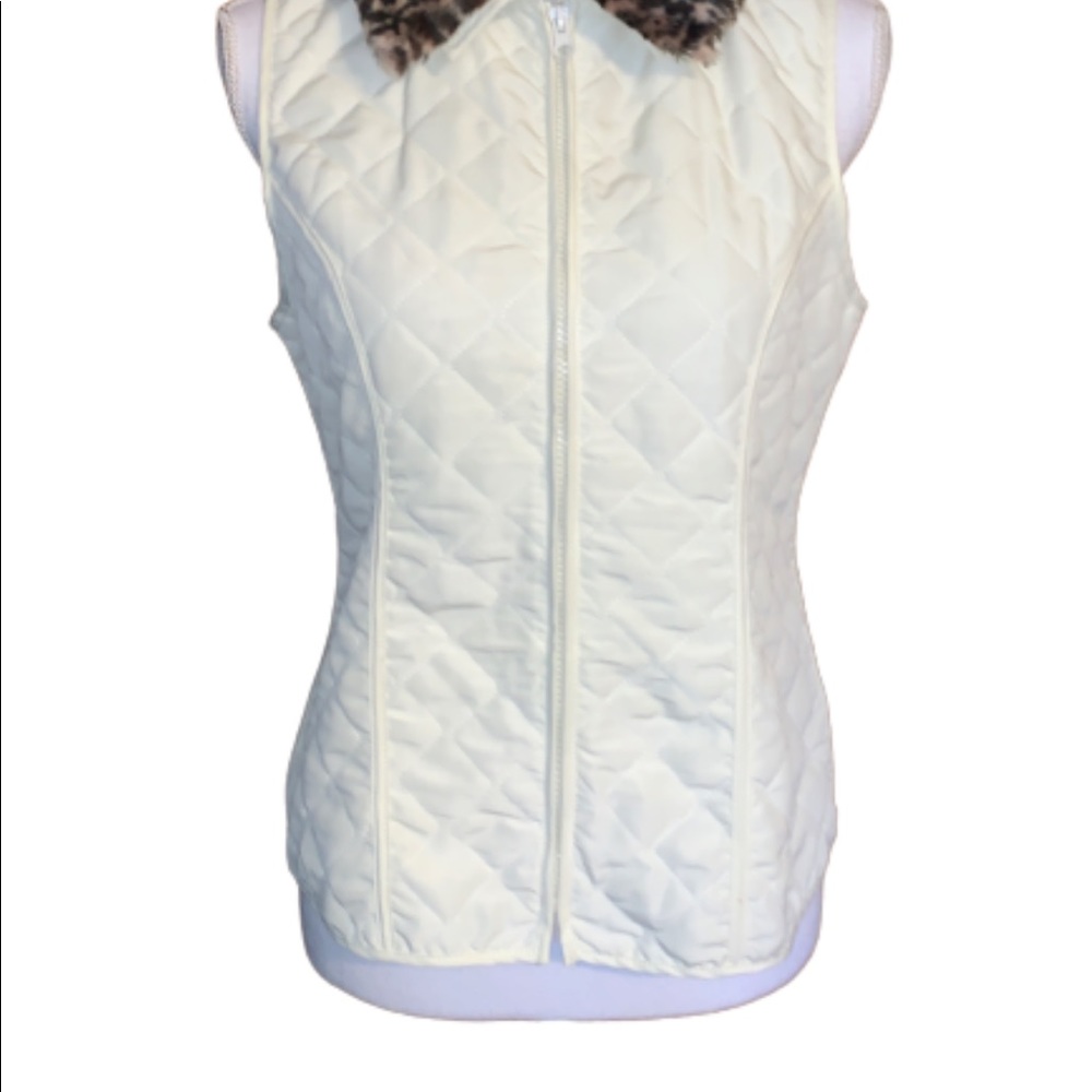 Kim Rogers white vest
